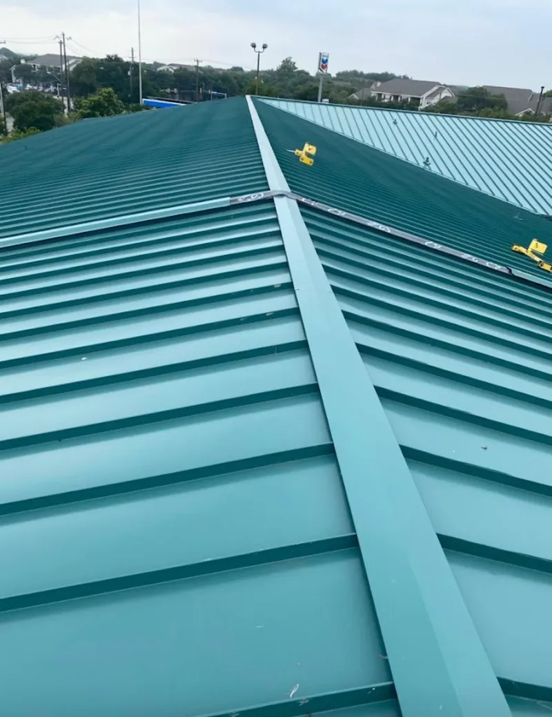 Green commercial metal roof ridge and valley for Metal Roof Repair in Prairie Ridge