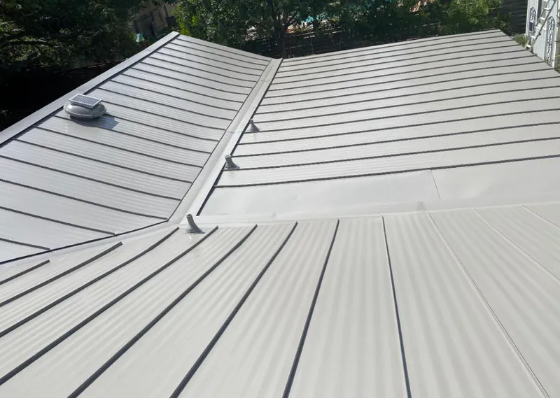 Solar attic fan installed on a metal roof for Roof Ventilation in Prairie Ridge